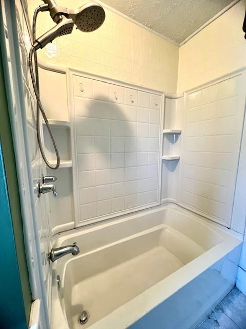 582 Spruce Ave, Sharon, PA 16146 - bathroom featuring a textured ceiling and shower / washtub combination