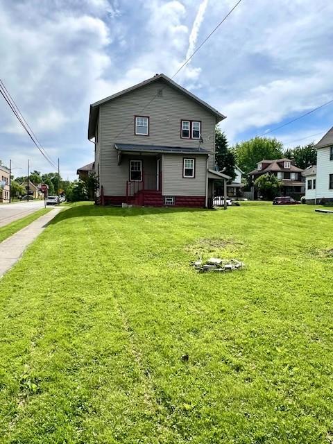 582 Spruce Ave, Sharon, PA 16146 - back of house with a lawn