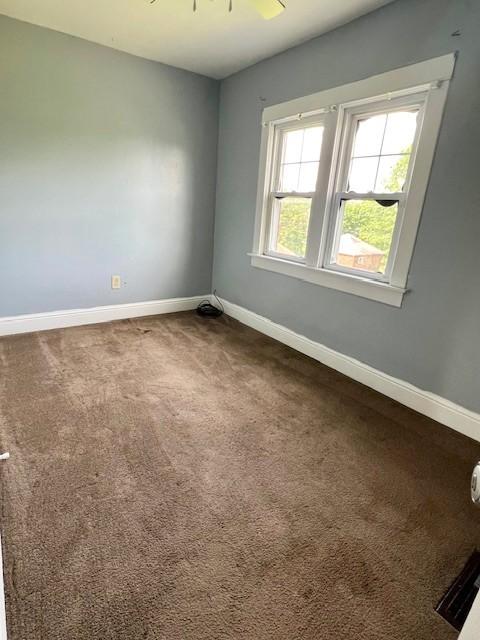 582 Spruce Ave, Sharon, PA 16146 - unfurnished room with baseboards and dark carpet