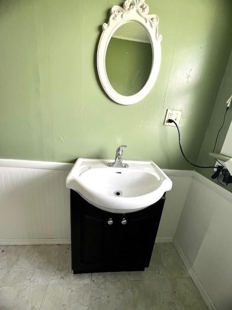 582 Spruce Ave, Sharon, PA 16146 - bathroom with vanity and a wainscoted wall
