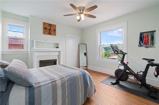 1622 Ridge Ave, Coraopolis, PA 15108 - bedroom featuring light wood-style floors, multiple windows, baseboards, and a ceiling fan