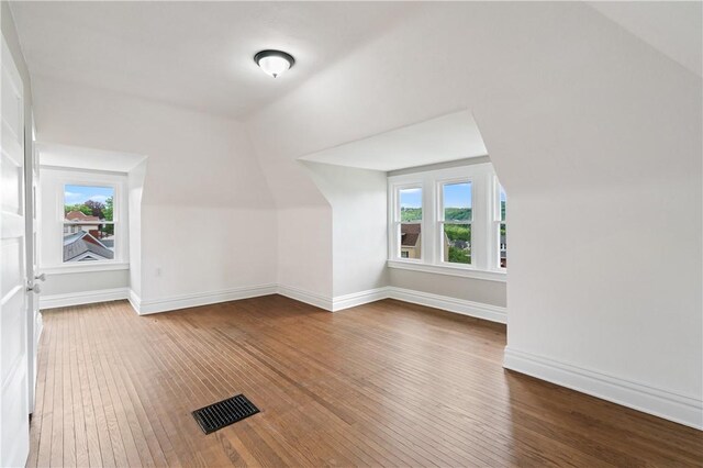 1622 Ridge Ave, Coraopolis, PA 15108 - additional living space with wood-type flooring, vaulted ceiling, and baseboards