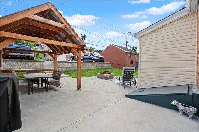 1622 Ridge Ave, Coraopolis, PA 15108 - fenced backyard with an outdoor fire pit, a gazebo, a patio, outdoor dining space, and grilling area