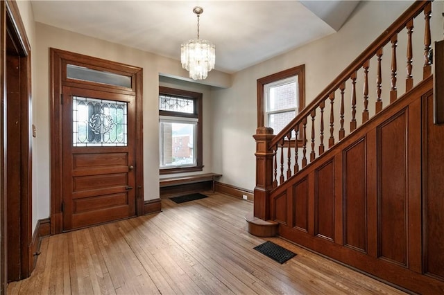 1622 Ridge Ave, Coraopolis, PA 15108 - entrance foyer with baseboards, stairway, a chandelier, and healthy amount of natural light