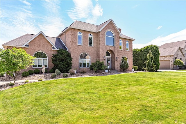 585 Agnes St, Hempfield Twp Wml, PA 15601 - view of front facade featuring a front lawn and brick siding
