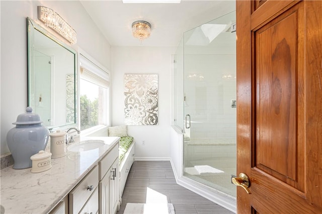 585 Agnes St, Hempfield Twp Wml, PA 15601 - bathroom featuring a shower stall, baseboards, vanity, and wood finished floors