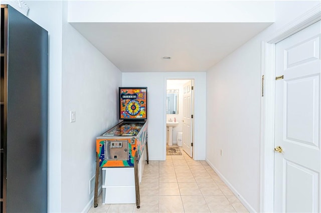 585 Agnes St, Hempfield Twp Wml, PA 15601 - hallway with baseboards, a sink, and light tile patterned floors