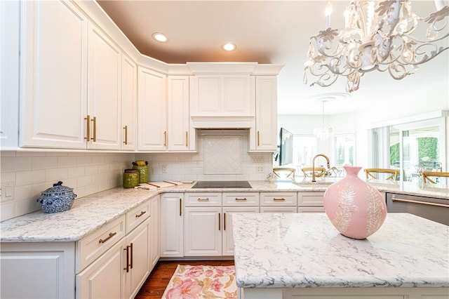 585 Agnes St, Hempfield Twp Wml, PA 15601 - kitchen with a chandelier, a sink, dark wood-style flooring, black electric stovetop, and white cabinetry