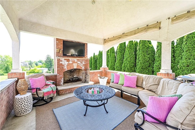 585 Agnes St, Hempfield Twp Wml, PA 15601 - view of patio featuring an outdoor living space with a fireplace