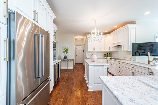 585 Agnes St, Hempfield Twp Wml, PA 15601 - kitchen featuring appliances with stainless steel finishes, a sink, a chandelier, white cabinetry, and recessed lighting