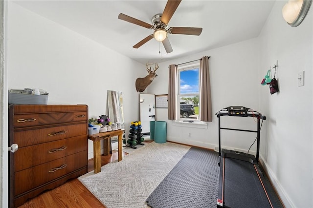 136 Isabella St, Derry Twp, PA 15717 - exercise area featuring a ceiling fan, wood finished floors, baseboards, and baseboard heating