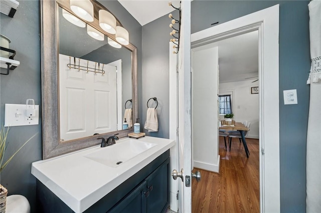 136 Isabella St, Derry Twp, PA 15717 - half bath featuring wood finished floors, vanity, and baseboards