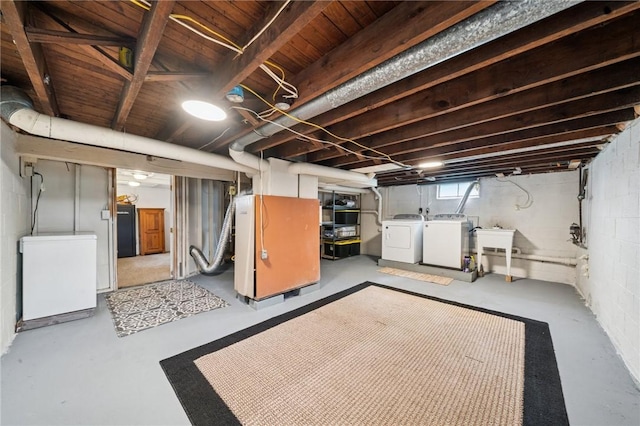 136 Isabella St, Derry Twp, PA 15717 - below grade area featuring refrigerator, washer and clothes dryer, and a sink