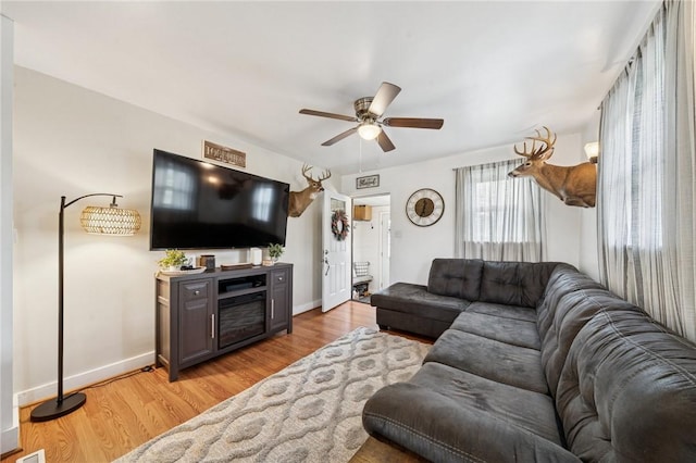 136 Isabella St, Derry Twp, PA 15717 - living room featuring a ceiling fan, light wood finished floors, and baseboards
