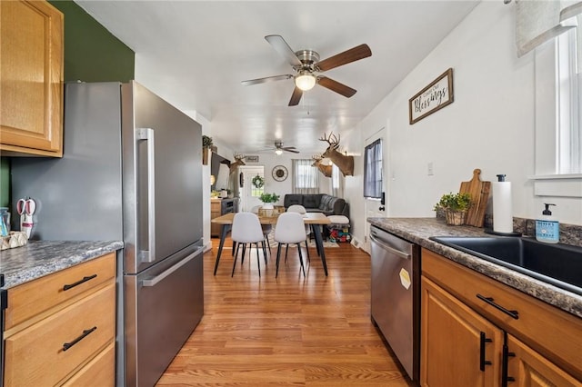 136 Isabella St, Derry Twp, PA 15717 - kitchen with appliances with stainless steel finishes, ceiling fan, light wood-style floors, a sink, and open floor plan