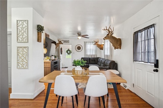 136 Isabella St, Derry Twp, PA 15717 - dining space with a ceiling fan, light wood finished floors, and baseboards