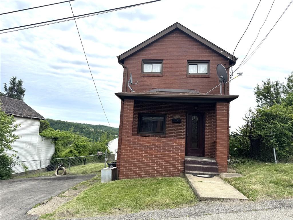 921 Chestnut St, Duquesne, PA 15110 - view of front of home with brick siding