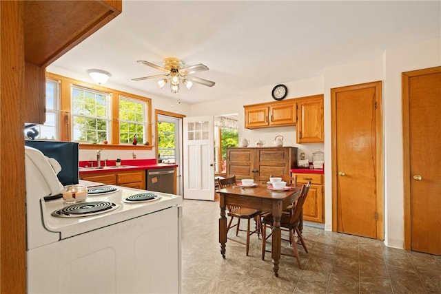 865 W Sanner St, Somerset Boro, PA 15501 - kitchen with white range with electric stovetop, a sink, dishwasher, a ceiling fan, and brown cabinetry