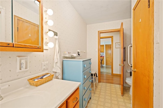 865 W Sanner St, Somerset Boro, PA 15501 - bathroom featuring tile patterned floors, vanity, wallpapered walls, and toilet