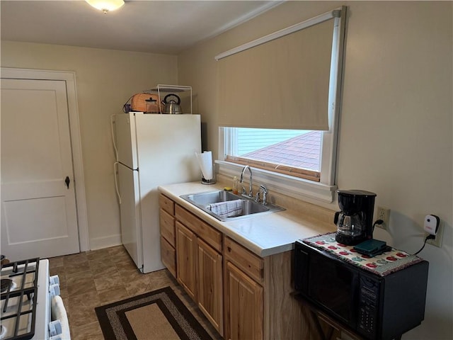1335R 4th Ave, Ford City Boro, PA 16226 - kitchen featuring a sink, white appliances, light countertops, and brown cabinetry
