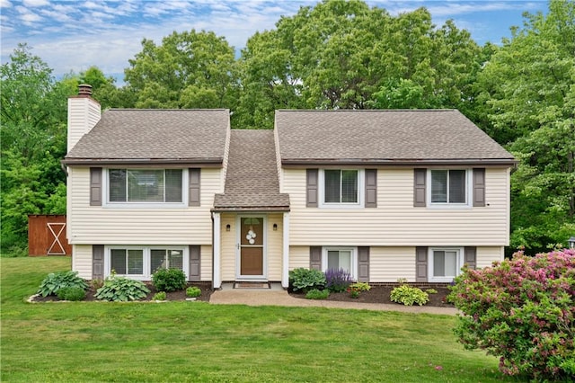 15 Fawnridge Dr, Robinson Twp Nwa, PA 15136 - bi-level home featuring a front yard, a chimney, and a shingled roof