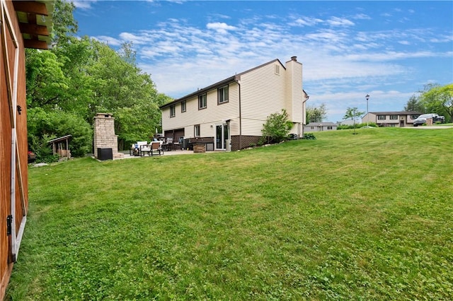 15 Fawnridge Dr, Robinson Twp Nwa, PA 15136 - back of property with a chimney and a lawn