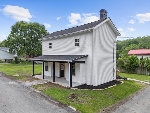 103 Depot St, Midway, PA 15060 - view of front of house featuring covered porch, a front lawn, a chimney, and roof with shingles
