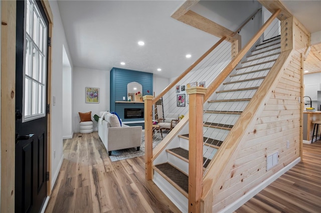 103 Depot St, Midway, PA 15060 - stairs with wood finished floors, recessed lighting, a fireplace, and baseboards