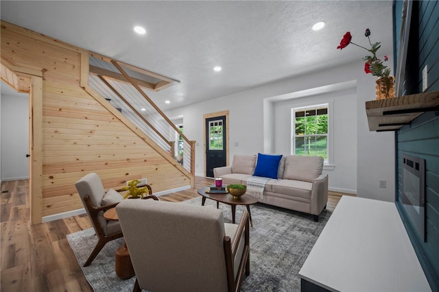 103 Depot St, Midway, PA 15060 - living room with stairway, wooden walls, wood finished floors, recessed lighting, and baseboards