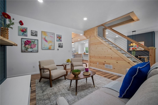 103 Depot St, Midway, PA 15060 - living room featuring wood finished floors, stairs, recessed lighting, baseboards, and wooden walls