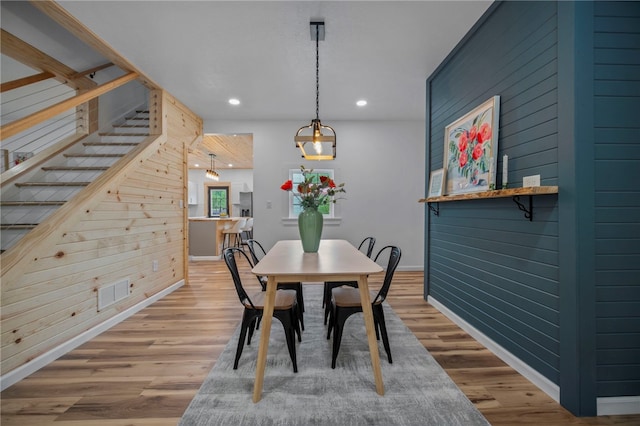 103 Depot St, Midway, PA 15060 - dining space featuring wood walls, baseboards, light wood-style flooring, recessed lighting, and stairway