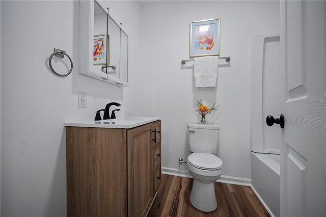 103 Depot St, Midway, PA 15060 - full bath with toilet, wood finished floors, vanity, baseboards, and a bath