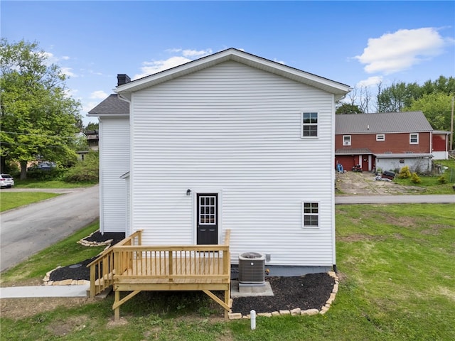 103 Depot St, Midway, PA 15060 - back of property with a deck, a yard, central air condition unit, and a chimney