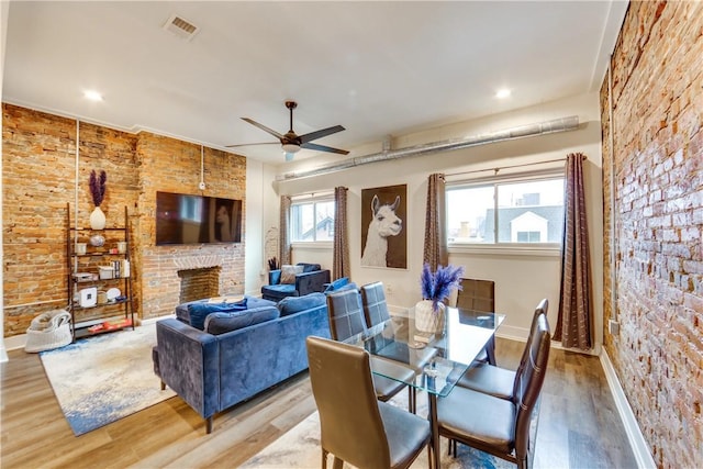 514 Knoll St, Central North Side, PA 15212 - dining room featuring baseboards, wood finished floors, ceiling fan, a brick fireplace, and recessed lighting