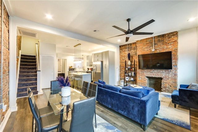 514 Knoll St, Central North Side, PA 15212 - living room featuring ceiling fan, wood finished floors, stairs, a brick fireplace, and recessed lighting