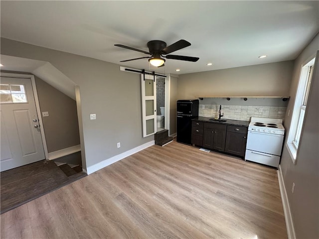 514 Knoll St, Central North Side, PA 15212 - kitchen featuring white range with electric cooktop, a barn door, fridge, a ceiling fan, and light wood-style flooring