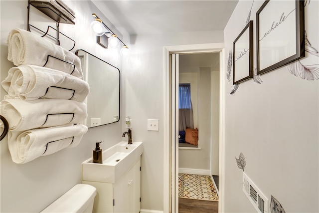 514 Knoll St, Central North Side, PA 15212 - bathroom featuring wood finished floors, vanity, baseboards, and toilet