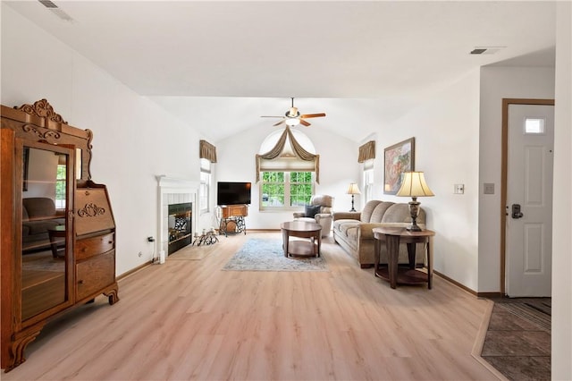 22 Ashford Dr, Cranberry Twp, PA 16066 - living area featuring light wood-type flooring, baseboards, lofted ceiling, ceiling fan, and a fireplace