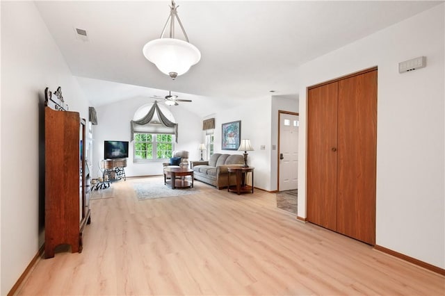22 Ashford Dr, Cranberry Twp, PA 16066 - living room featuring ceiling fan, light wood-style floors, baseboards, and lofted ceiling