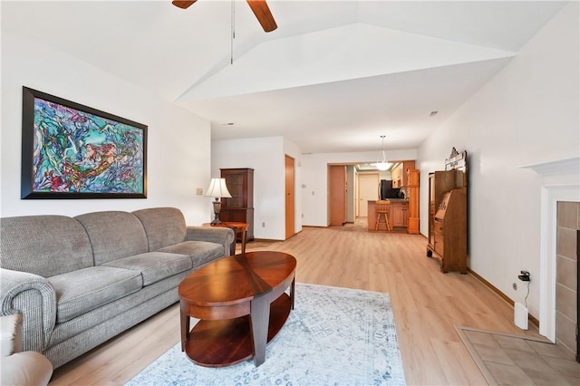 22 Ashford Dr, Cranberry Twp, PA 16066 - living area featuring light wood-style flooring, lofted ceiling, ceiling fan, and baseboards