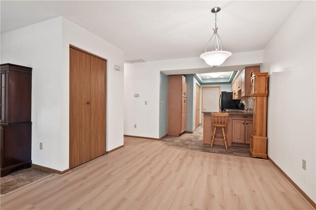 22 Ashford Dr, Cranberry Twp, PA 16066 - unfurnished dining area featuring light wood-style flooring and baseboards