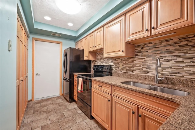 22 Ashford Dr, Cranberry Twp, PA 16066 - kitchen with black appliances, a sink, a textured ceiling, tasteful backsplash, and light stone counters