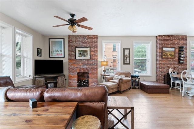 4232 Sherrod St, Lawrenceville, PA 15201 - living room with a brick fireplace, light wood-style flooring, and ceiling fan
