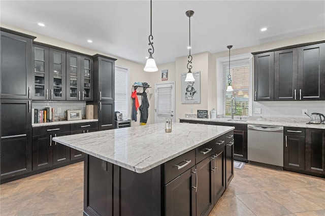 4232 Sherrod St, Lawrenceville, PA 15201 - kitchen with stainless steel dishwasher, a sink, backsplash, a kitchen island, and recessed lighting