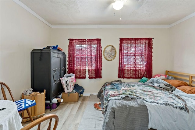 134 S 19th St, South Side, PA 15203 - bedroom with wood finished floors, ornamental molding, a textured ceiling, and ceiling fan