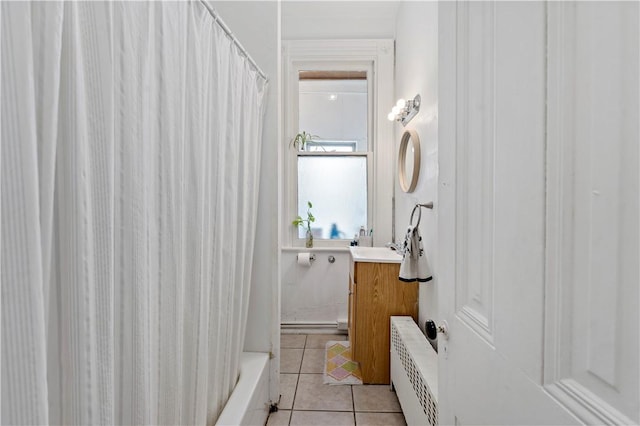 134 S 19th St, South Side, PA 15203 - bathroom with radiator, tile patterned floors, vanity, and shower / bath combination with curtain