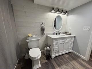 518 Equestrian Way, Mount Pleasant Twp Wml, PA 15666 - bathroom featuring wood finished floors, toilet, vanity, and baseboards
