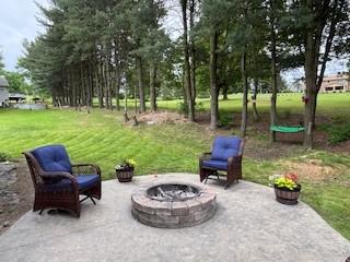518 Equestrian Way, Mount Pleasant Twp Wml, PA 15666 - view of patio with a fire pit