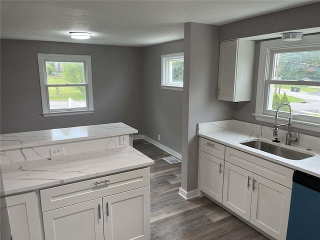3309 Woodvue Dr, Whitehall, PA 15227 - kitchen with a sink, dishwasher, dark wood-type flooring, white cabinets, and baseboards