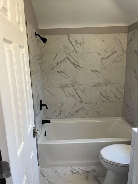 3309 Woodvue Dr, Whitehall, PA 15227 - bathroom featuring marble look tiles, bathing tub / shower combination, and toilet